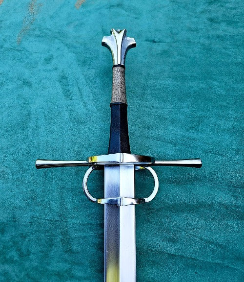 A European Renaissance Hand and a Half Sword with a cross-guard, featuring a carbon steel blade, wooden grip, and fish-tail steel pommel.