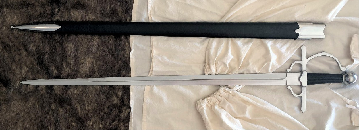 A Renaissance cut and thrust side sword with a cross-guard and pommel, alongside a wood-lined leather-covered scabbard.
