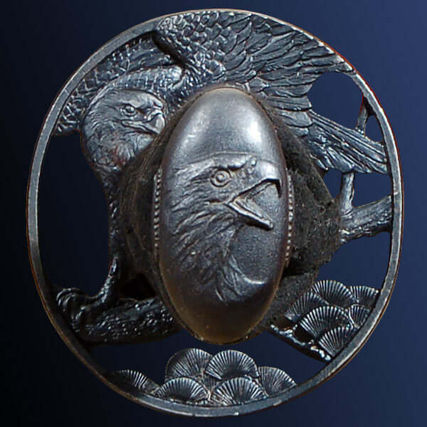 Raptor Katana Tsuba featuring an eagle design with intricate detailing, showcasing craftsmanship and artistry.