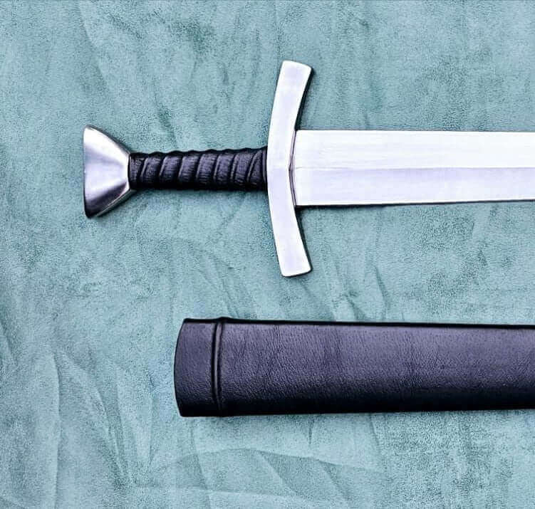 Close-up of a Bowman and Saddle Sword replica with a detailed hilt and sheath, ideal for collectors.