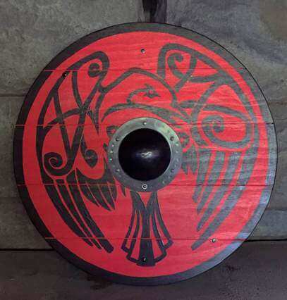 Handmade Medieval Armour Inspiration featuring a red shield with intricate black designs.
