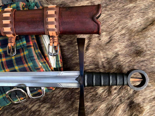 Irish Kern Warriors history: traditional sword and scabbard displayed on a textured surface.