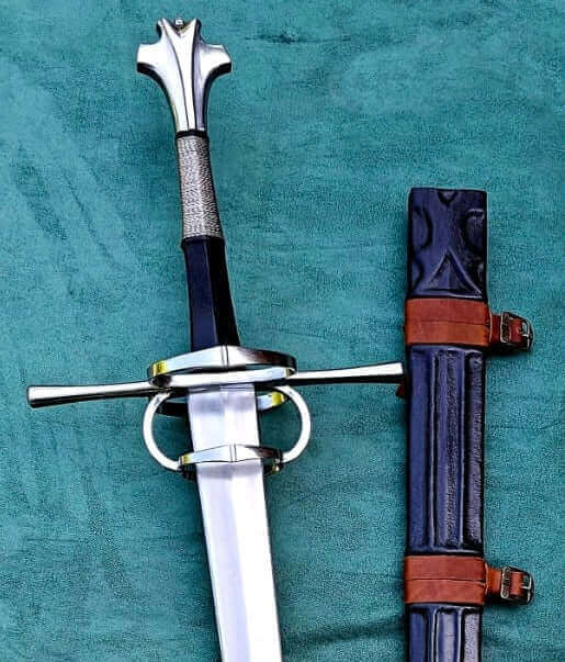 Why Kingdom of Arms is a Cut Above the Rest: a beautifully crafted sword with a detailed hilt and elegant scabbard.