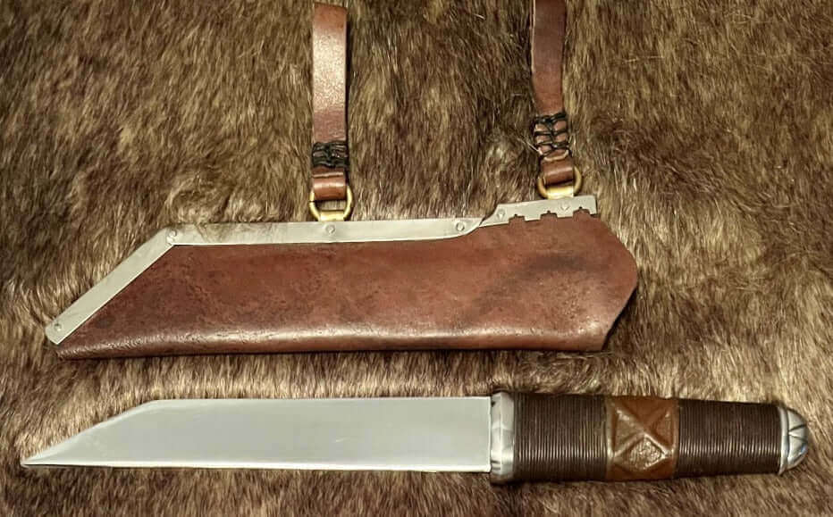 What the Seax knife displayed with its sheath, showcasing historical craftsmanship and design.