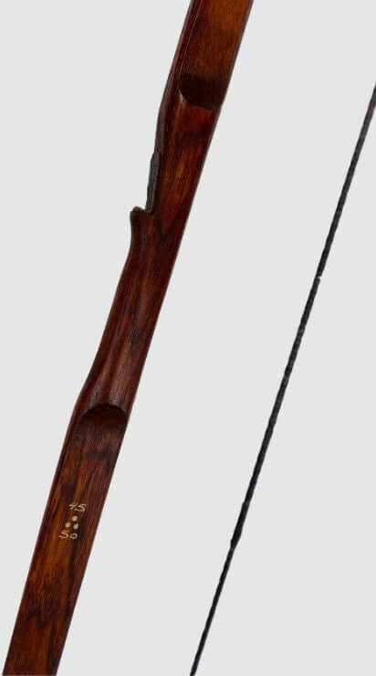 Bushman hunting flatbow 65 inch close-up showing the craftsmanship and details in the wooden bow design.