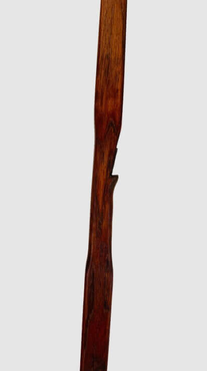 Bushman hunting flatbow 65 inch showcasing its brown stained wood finish and smooth design for effective bowhunting.