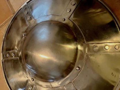 14 inch Hammered Steel Buckler Medieval Shield – top view of a shiny, domed buckler with visible fastening rivets.