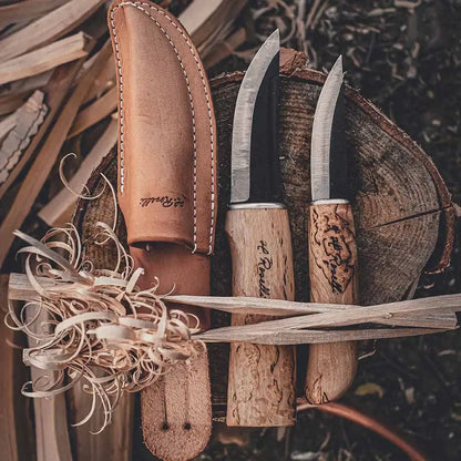 Roselli R190 Hunter / Carpenter Combo featuring two knives and a leather sheath on a wooden surface.