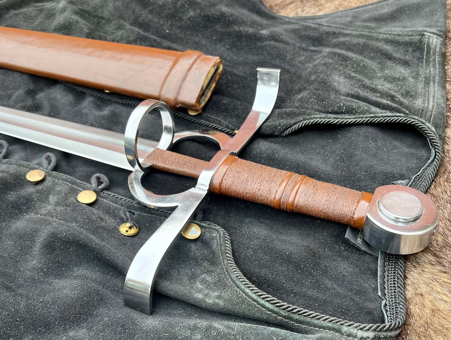 Renaissance Battle Sword and Buckler Combo featuring hand-forged sword and buckler on a black fabric background.