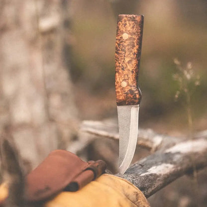Roselli Hunter Full Tang R100FD Dark Stained Handle with FireSteel resting on a glove next to a log.