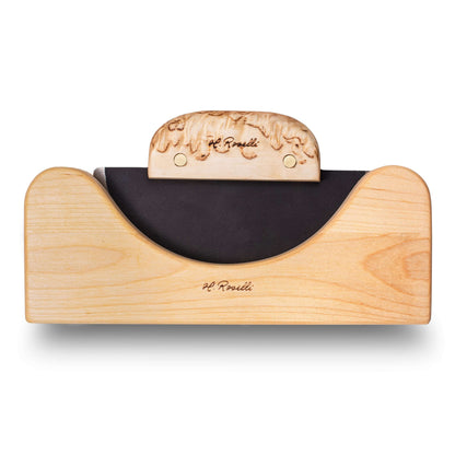 Roselli R740 The Ulu Knife displayed in a birch rack showcasing its forged carbon steel blade and curly birch handle.