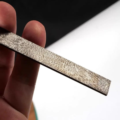 Wootz Steel Knife Making Damascus Blanks displayed in hand, showcasing the intricate pattern and quality.