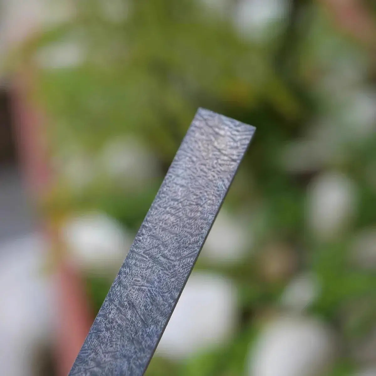 Wootz Steel Knife Making Damascus Blanks showcasing the unique pattern and texture of the steel bar.
