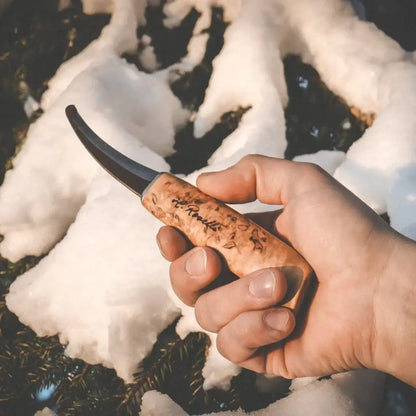 Roselli R161 Opening Knife with Blunt Tip held in hand against a snowy background.